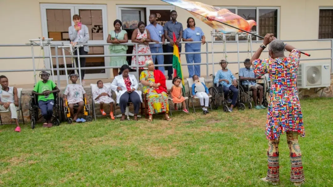 Foundation representative speaking with participants at a disability inclusion event